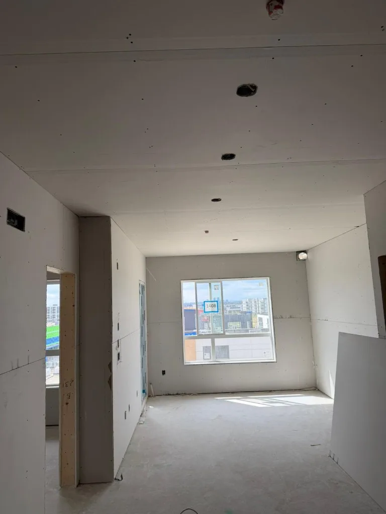 Modern apartment buildings on active construction site
