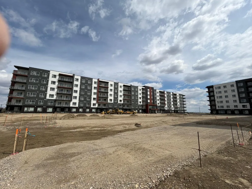 Apartment complex exterior with modern siding and balconies