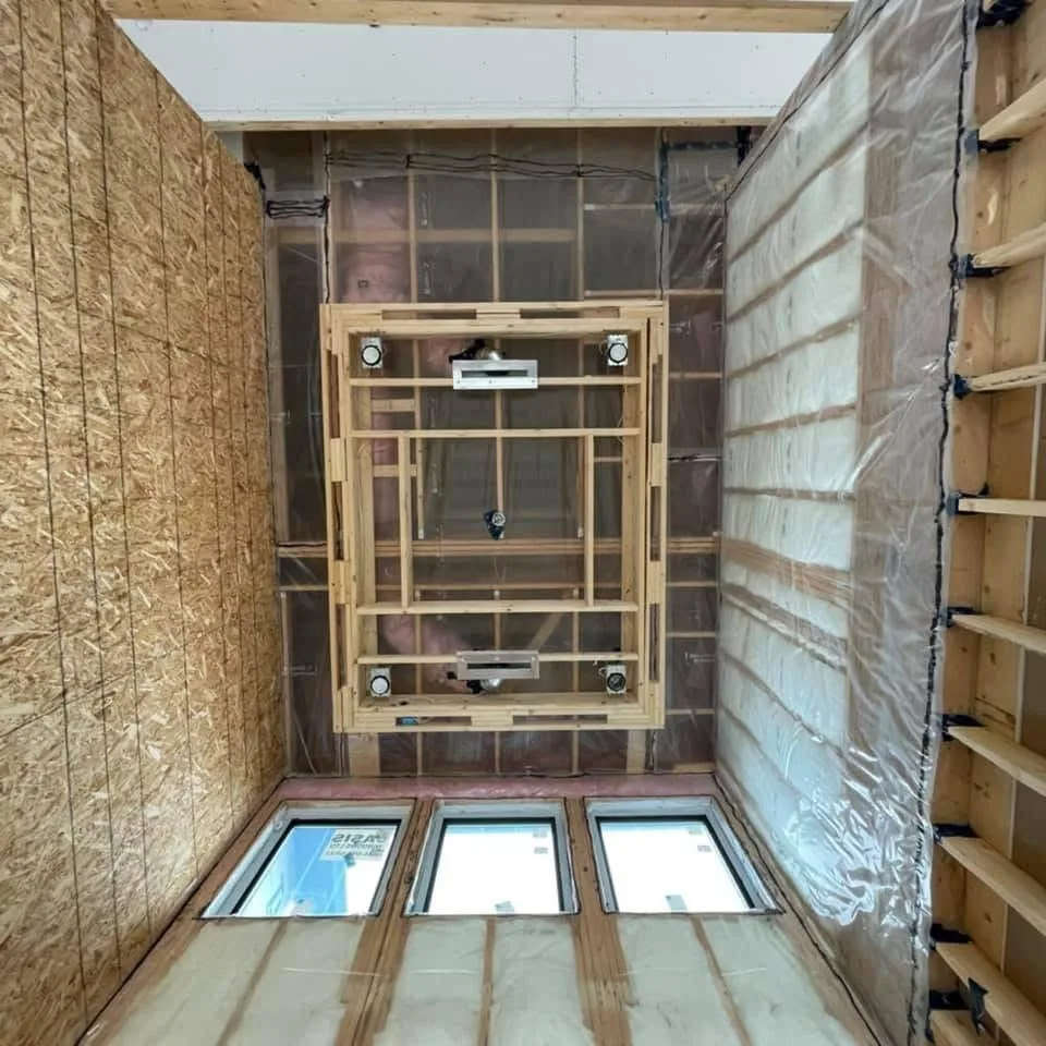Room framing with OSB sheathing and ceiling light housings